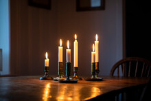 Lit Candles On Wooden Table