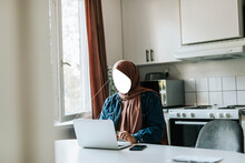 Faceless Woman Using Laptop At Home