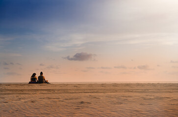 Wall Mural - colorful clouds and blue sky with the sunset for nature textured background. couple sitting