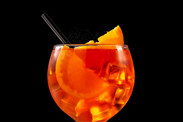 Wall Mural - Glass of aperol spritz cocktail on black background. Close up