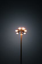Vertical Shot Of A High Mast Lighting System On A Dark Black Sky Background