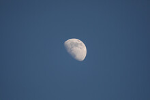 Closeup Of A Gibbous Moon On A Dark Blue Sky