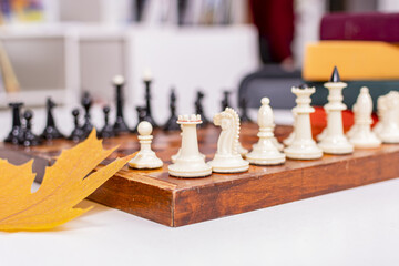 Sticker - Chess black and white pieces stand on wooden chessboard. Everything is ready to play.