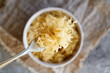 Sauerkraut or fermented cabbage on a fork
