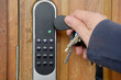Opening front door with electronic lock and key fob with open light on
