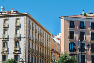 Classy houses in pastel colours in the central district of Madrid, Spain