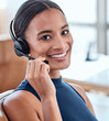 © C Coetzee/peopleimages.com - Im always happy to help. Shot of a beautiful young woman working in a call center.