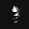 © Rytis - Beauty, fashion, abstract concept. Black and white part of woman face in black shadow background with copy space. Nose is in camera focus. Selective focus and image with shallow depth of field