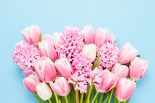 Bunch Of Pink Hyacinths And Tulips On Blue Background. Mothers Day, Valentines Day, Birthday Concept