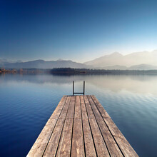 Wooden Pier On Lake On A Quiet Morning