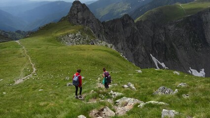 Wall Mural - mother with daughters hiking by the fagaras ridge