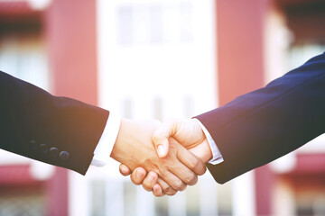 Closeup of a businessman hand shake investor between two colleagues  OK, succeed in business Holding hands.