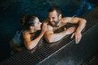 © BGStock72 - Young couple relaxing in a swimming pool
