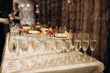 Wall Mural - glasses of champagne at a wedding festive buffet