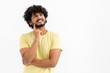 © kucherav - Thoughtful Asian male on white background contemplates about something, thinking an idea