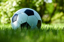 Football Ball On Green Grass Lawn
