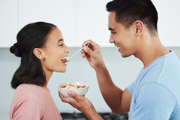 Canvas Print - Keeping it fresh and healthy. Shot of a husband feeding his wife food.