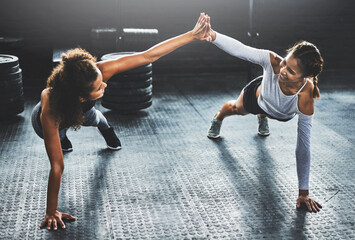 Poster - bring your best friend and give it your best. shot of two young women giving each other a high five 