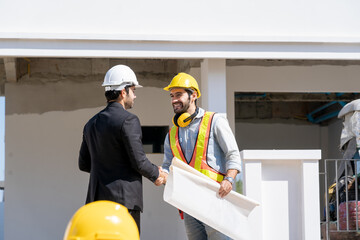 Poster - Engineer handshake with businessman after finishing up meeting in construction site,Connection industrial and investment concept.