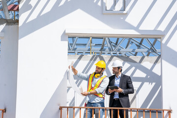Poster - Engineer with business manager are talking in construction site,Project owner with blueprint working to new residential home building work site.
