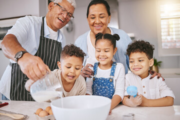 Canvas Print - Could I have a glass when youre done. Shot of a mature couple baking with their grandkids at home.