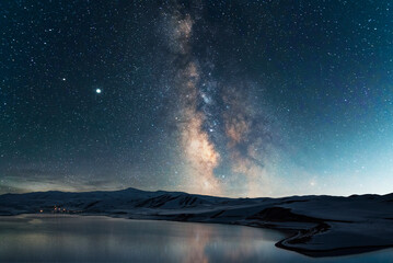 Wall Mural - beautiful night landscape. bright milky way galaxy over the lake and mountains.