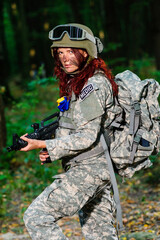 Wall Mural - Ukranian female soldier in the forest