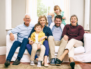 Poster - There is no love like the love of a family. Shot of a multigenerational family sitting on the sofa at home.