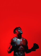 Poster - Ill always have some fight in me. Red filtered shot of a sportsman wearing boxing gloves.