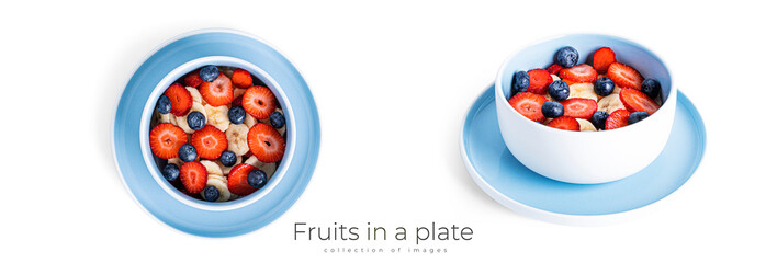 Wall Mural - Oatmeal with fruit isolated on a white background. Oatmeal with strawberries, blueberries and banana.