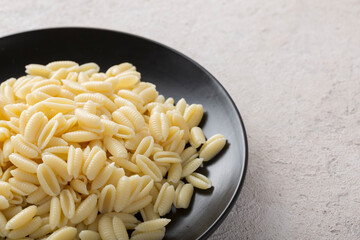 Wall Mural - Freshly cooked gnocchi pasta close-up in a frying pan. Italian cooking