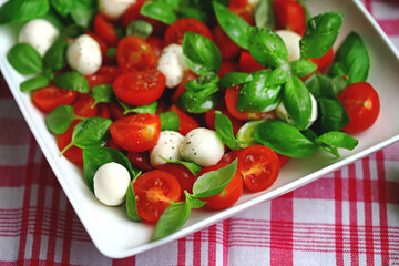 Wall Mural - Caprese salad with mini mozzarella and cherry tomatoes. Italian Cuisine. Healthy food.