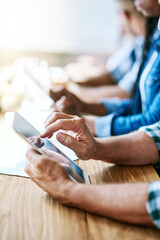 Poster - Information is power so be powerful. Cropped shot of businesspeople using digital tablets while sitting in a meeting.