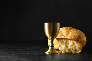 Wall Mural - Cup of wine with bread on dark background