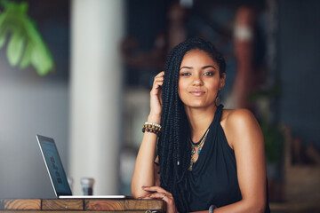 Poster - You should check out my blog. Cropped portrait of an attractive young woman using her laptop in a coffee shop.