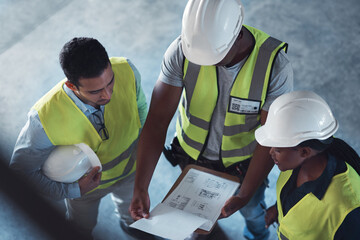 Poster - Weve got to arrange these perfectly. High angle shot of a group of contractors standing in the warehouse together and having a discussion.