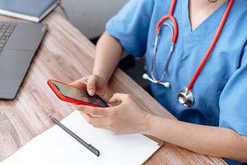 doctor using mobile phone, health staff using a phone. medical service online concept.