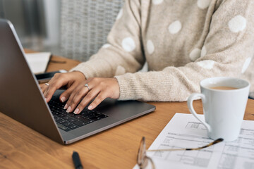 Poster - Youll always find a more convenient way online. Cropped shot of a woman using her laptop while working from home.