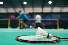 Shuttlecock On Green Badminton Playing Court
