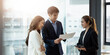 © Natee Meepian - Entrepreneur asian business people discussing new business project in paper sheet in modern meeting room.