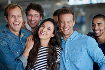 Poster - Were all here to support each other. Shot of a smiling group of coworkers standing in an office.