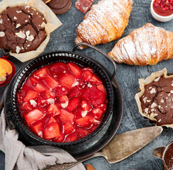 Wall Mural - Dessert table with all kinds of cakes and snacks.