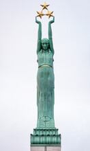 The Freedom Monument In Riga, Latvia. A Woman Named Milda Holding Three Stars