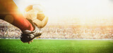 Fototapeta Sport - soccer player kicking ball action in the stadium banner size