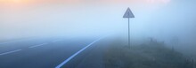 An Open Highway In A Fog. Sunrise. Driving A Car Through The Country Fields. Leisure Activity, Recreation, The Way Forward Concepts