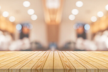 Wall Mural - Empty wood table top with cafe restaurant interior blurred background