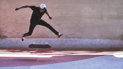 Sticker - Take a chance. Shot of a young man doing tricks on his skateboard at the skatepark.