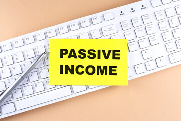 Poster - Text PASSIVE INCOME text on a sticky on keyboard, business concept