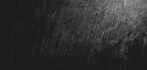 Wall full of scratches. Grungy cement texture for background, Scary dark wall.Black wall