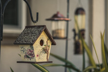 Closeup Shot Of A Wooden Birdhouse With Beautiful Design
